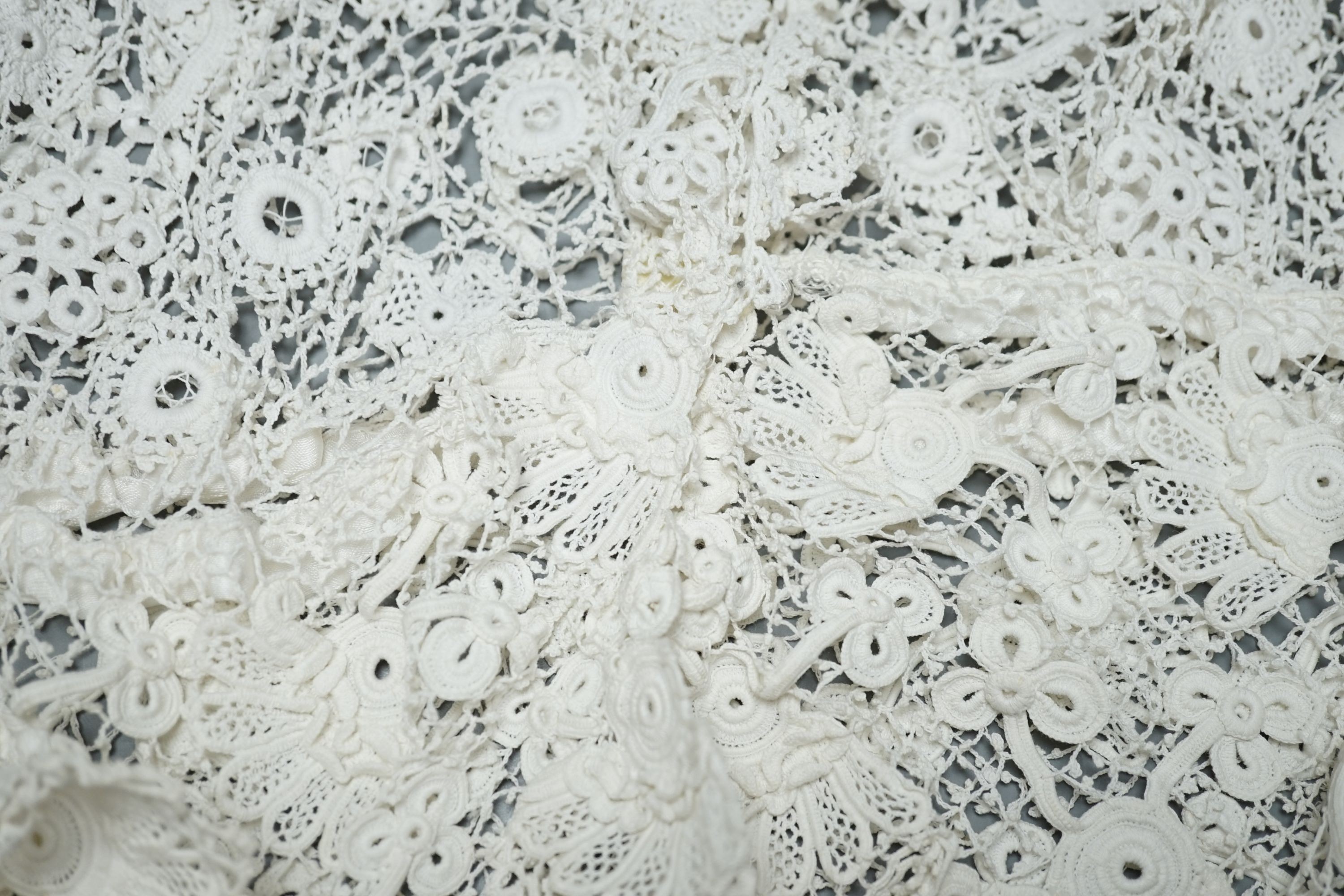 A 19th century hand made Irish crochet jacket, with long sleeves and high collar, a bobbin lace and white worked patch worked blouse, a fine lawn and anglaise worked blouse and a fine bobbin lace trimmed and white worked